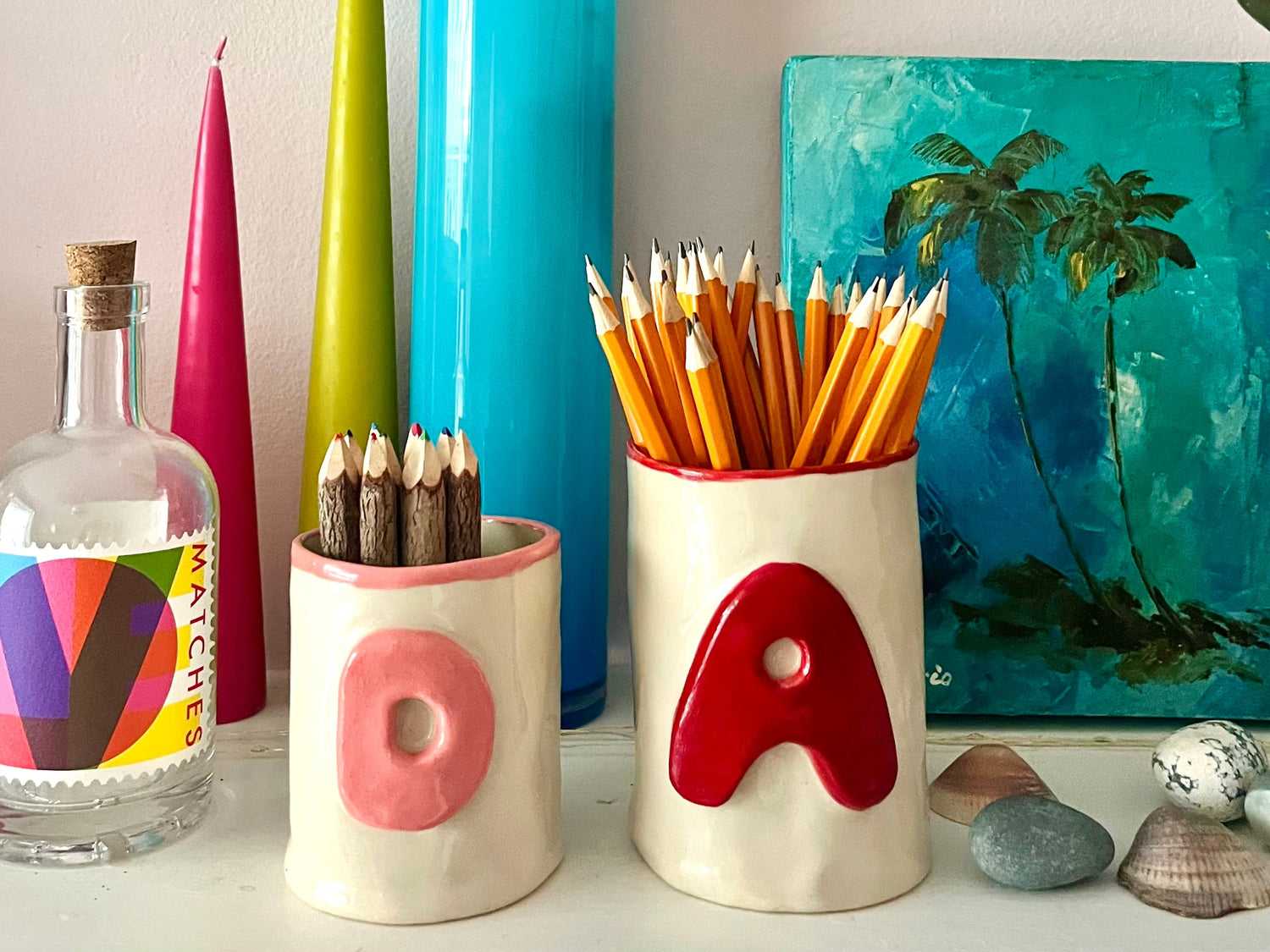 handmade ceramic alphabet beakers