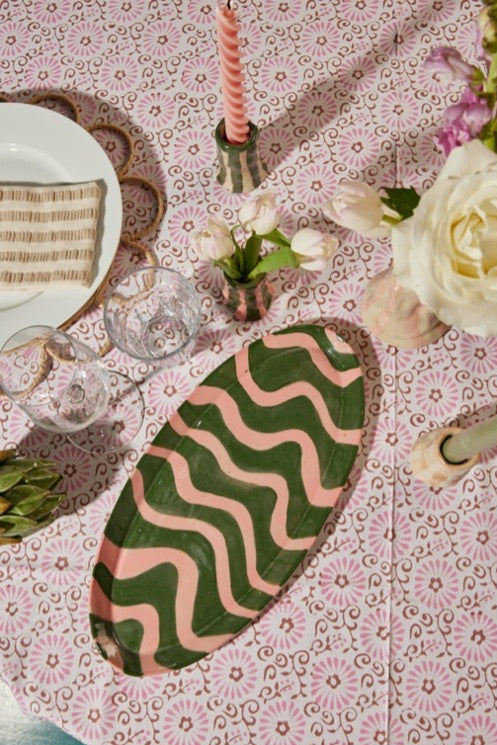 Green and pink serving platter with hand painted squiggles